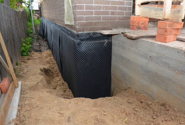 Happy homeowners after waterproofing job in Waukau